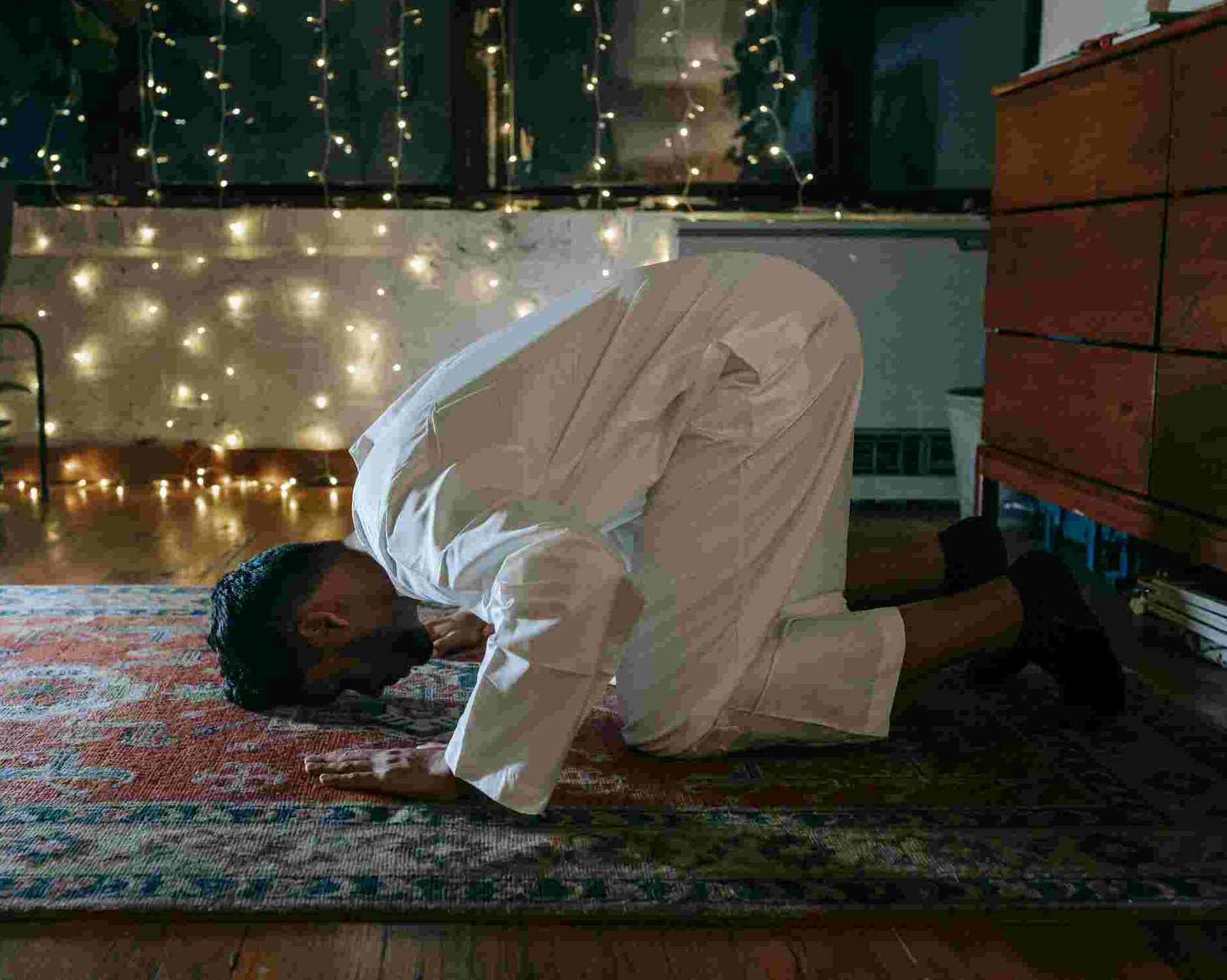 A Muslim performing Sujud, the prostration position in Salah.